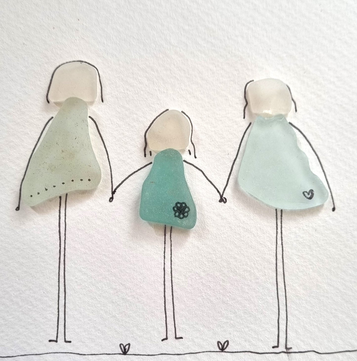 Seaglass artwork of a family of three, Seaglass artwork