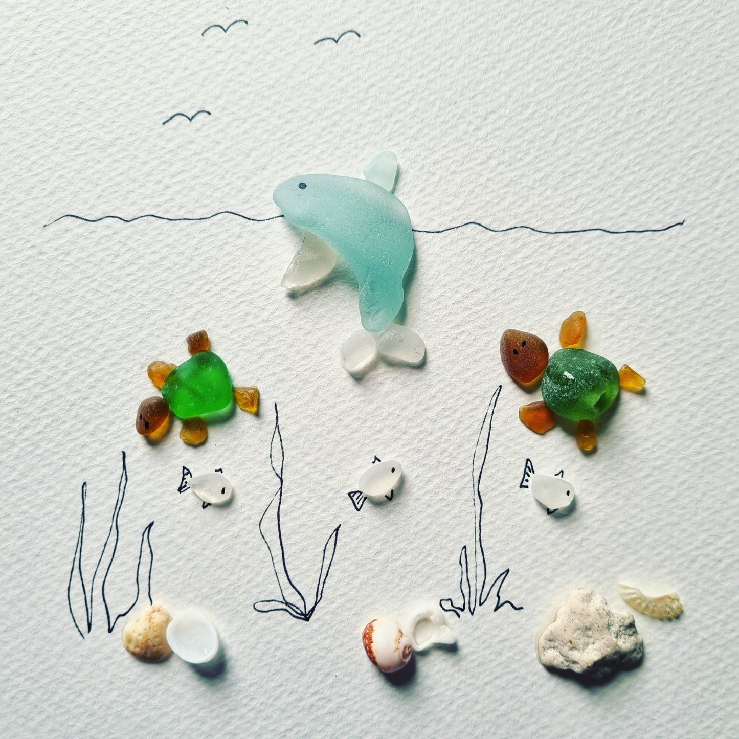 Seaglass artwork of sea creatures under the sea