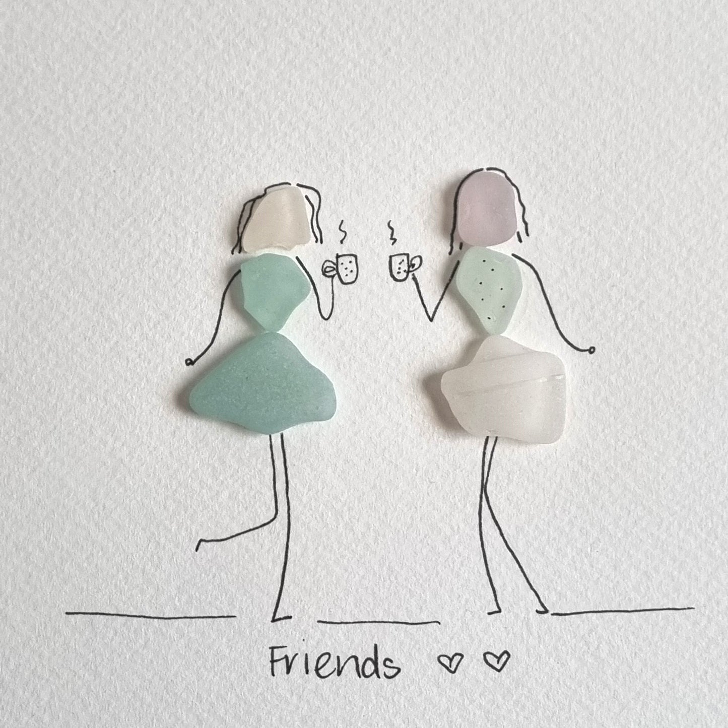 Seaglass artwork of two friends having a coffee