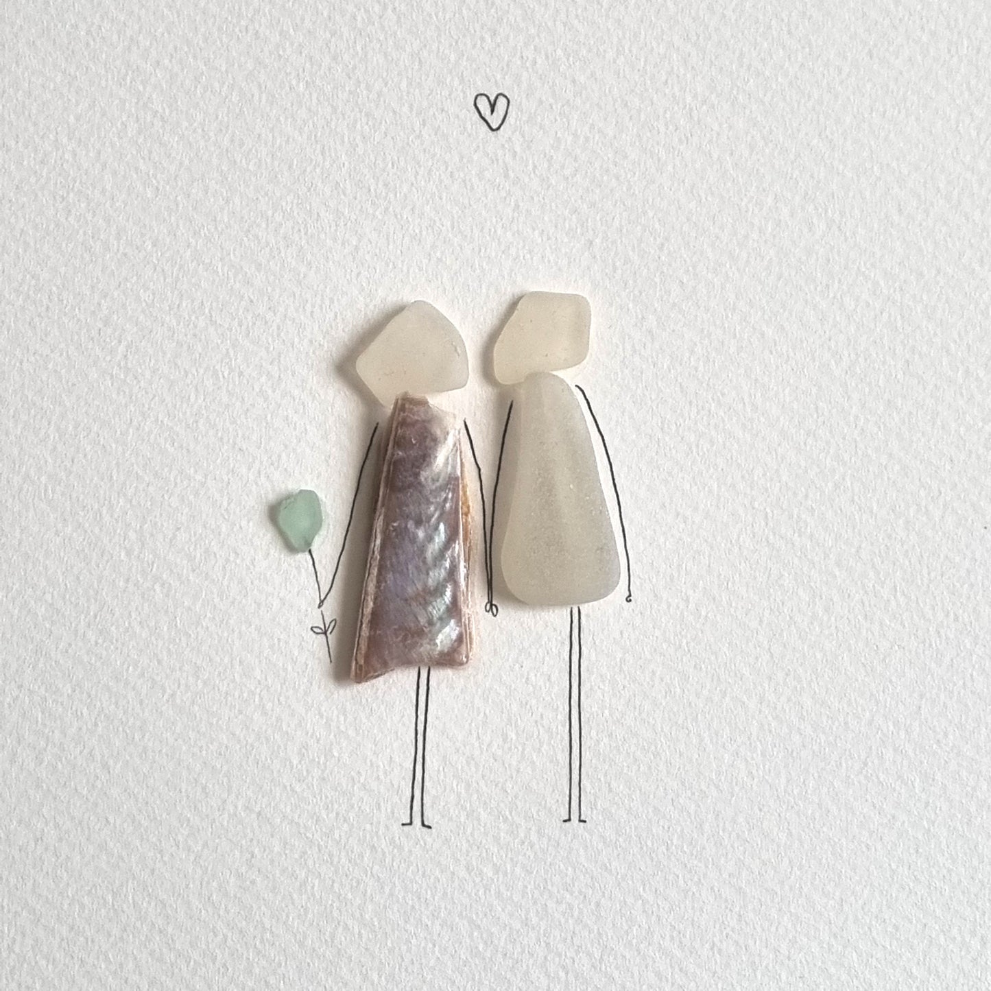 Seaglass artwork of a couple in love
